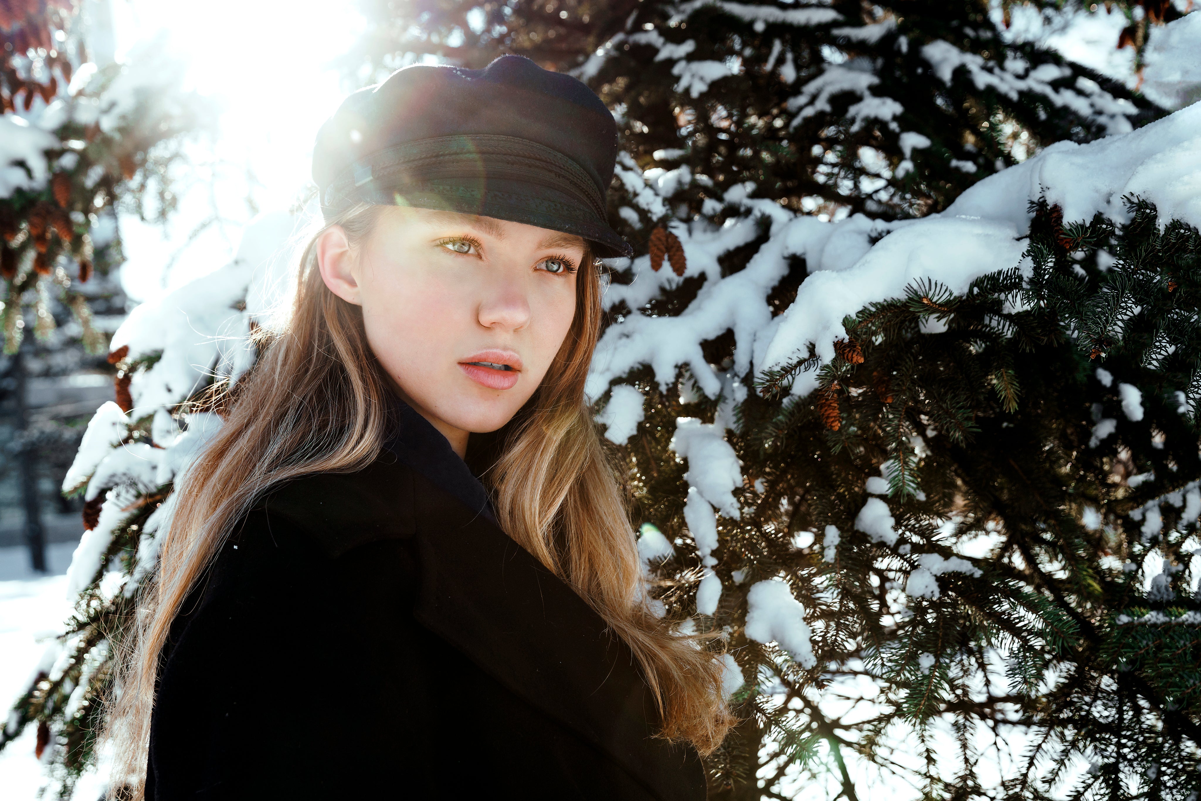 files/light-flare-behind-woman-in-snowy-wood.jpg